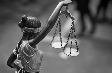 themis statue holding balance scales